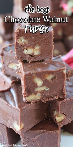 chocolate walnut fudge bars stacked on top of each other