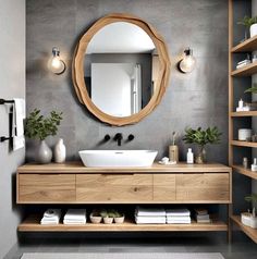 a bathroom with a sink, mirror and shelving unit in the middle of it