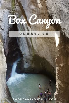 people are standing in the water at box canyon