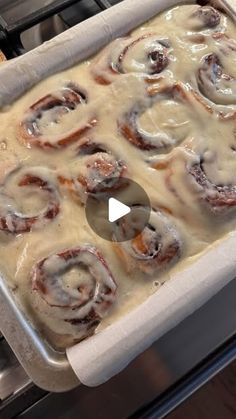 a pan filled with food sitting on top of an oven