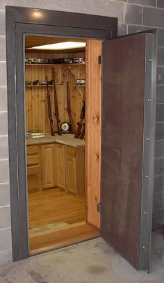 Gun Room with Spartan Vault Door | StashVault Safe Door, Hunting Room, Vault Doors, Door Organizer, Basement Remodeling, Cool Stuff