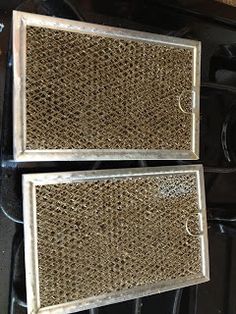 two air filters sitting on top of an oven