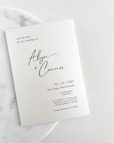 an elegant wedding program on a marble plate