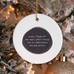 an ornament hanging from a christmas tree that reads, angels i need not on this empty trade than my ineffiable non anns