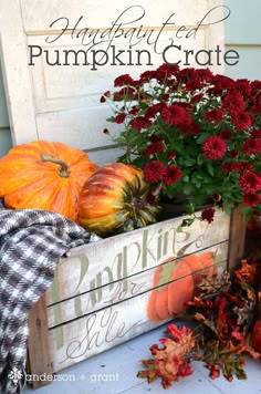 pumpkins and gourds in a wooden crate on the front porch for fall