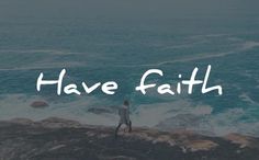 a man standing on top of a cliff next to the ocean with words have faith