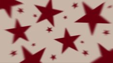 many red stars are flying in the air, and one is blurry with light