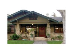 a house with a red front door and green trim