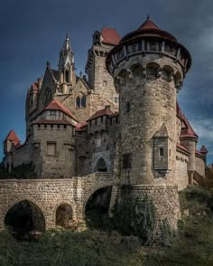 an old castle with two towers on top