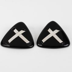 Anne and Frank Vigneri designed these lovely Lucite clip-on earrings in the 1980s. The geometric triangle design features a black Lucite element, topped with sterling silver crossed bands. The earrings are unsigned, but the special French clip-back is an unmistakable brand signature. Good condition, with minor wear on the metal, but nothing obvious, and some oxidation on the fastenings. Measurements: 2 in wide (5 cm) x 1.82 in high (4.6 cm).  Please see the measurements noted above in the descri French Clip, Triangle Design, Geometric Triangle, Sterling Silver Cross, Clip On Earrings, Band, Sterling Silver, Silver, How To Wear