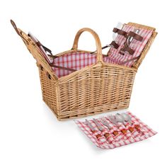 a picnic basket with utensils and napkins in it on a white background