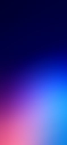 a blurry image of blue and pink colors