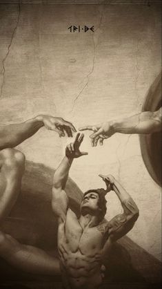 two men reaching for each other in front of a painting with their hands on the wall