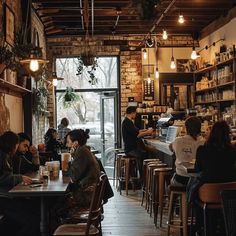 people are sitting at tables in a restaurant