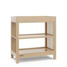 a wooden baby changing table with two shelves on the bottom and one shelf below it