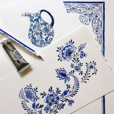 some blue and white flowers are on paper