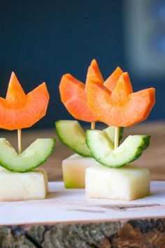 two slices of cucumber and carrot on sticks