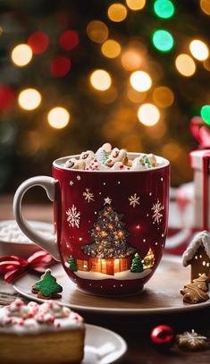 a cup of hot chocolate with marshmallows and christmas decorations