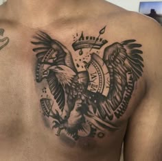 a man with an eagle tattoo on his chest