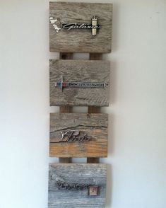 a wooden wall hanging with several different types of items on it