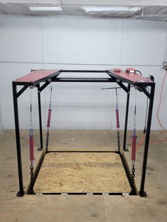 a portable work station in a garage with tools attached to the top and bottom parts