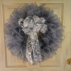 a wreath on the front door of a house