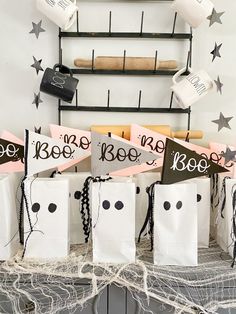 several bags with black and white designs are sitting on a table next to some bats