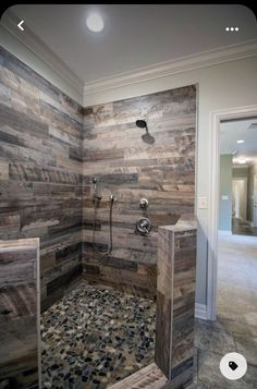 a walk in shower sitting inside of a bathroom