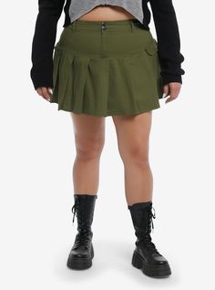 Keep your look fun and flirty in this green  low rise skirt! It comes with pleats and cargo pockets on the sides. Complete with a double button and zipper closure on the front.100% cottonWash cold; dry low16 12''ImportedModel is 5'10''Model wears size 1 Cheap 90s Style Mini Skirt, Cheap Forever 21 Tiered Mini Skirt, Green Utility Mini Skirt, Trendy Fitted Green Cargo Skirt, Fitted Green Pleated Bottoms, Green High-waist Cargo Skirt With Pockets, High Waist Green Cargo Skirt With Pockets, Fitted Green Cargo Skirt With Pockets, High Waist Green Skort For Fall