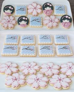 some decorated cookies on a white tray