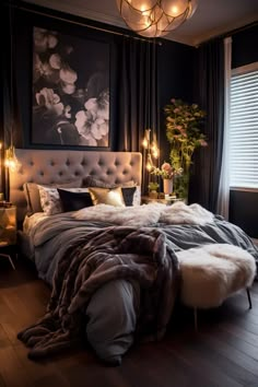 a bedroom with black walls and white fur on the bed