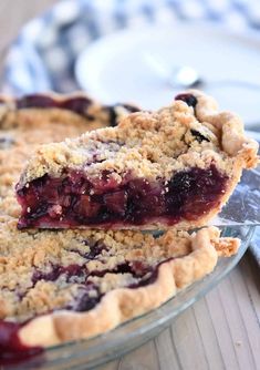 a close up of a pie on a plate with a slice taken out of it