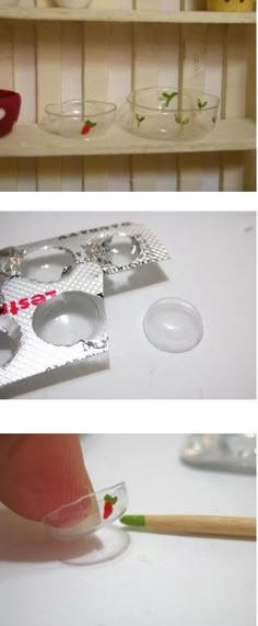 a pair of glasses sitting on top of a white table next to a plastic container