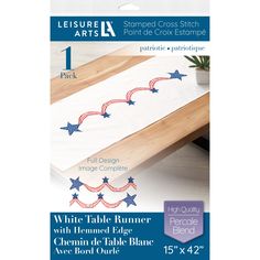 white table runner with red, white and blue stars on the edge by leisure arts