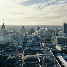 an aerial view of a city with tall buildings