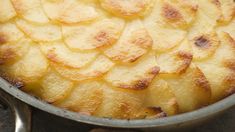 a pan filled with food sitting on top of a table