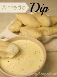 dipping sauce in a bowl with breadsticks on the side and text overlay reading alfredo dip