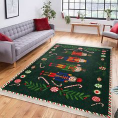 a living room filled with furniture and a christmas rug on top of a hard wood floor