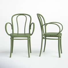 two green chairs sitting next to each other