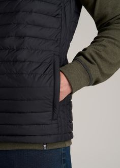 About Our Tall Men's Packable Puffer Vest Bring essential warmth on the go with our tall men's packable puffer vest. Designed specifically for guys from 6’3 to 7’1, this vest is long enough for your torso without being baggy. It’s been tailored with a modern fit that can be worn over any long sleeve polos or tees. The full zip makes it easy to customize your personal climate while the tall collar helps to block cool breezes. Insulated with lightweight poly fill, this vest jacket for tall men add Sleeveless Black Down Outerwear, Black Hiking Vest Outerwear, Functional Black Puffer Jacket For Hiking, Black Functional Puffer Jacket For Hiking, Black Casual Puffer Jacket For Travel, Casual Black Puffer Jacket For Travel, Black Nylon Puffer Jacket For Travel, Black Winter Hiking Vest, Black Puffer Vest For Outdoor