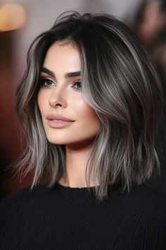 Click for More ➡️ | Save for Later ❤️  The stacked bob’s layers create volume at the crown, and ash grey highlights add a cool, contemporary edge to fine hair, making it look thick and sleek. (Stacked Bob with Ash Grey Highlights - Layered Hairstyles For Thin Hair) Gray Streaks In Dark Hair, Gray Highlights On Brown Hair, Dark Brown Hair With Gray Highlights, Dark Hair Grey Highlights, Hair Highlights Dark Brown, Trendy Hair Color 2024, Greyish Purple Hair, Ash Grey Highlights, Grey Highlights On Dark Hair