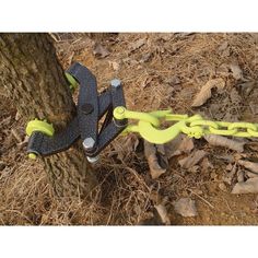 a pair of pliers attached to a tree