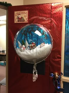 a christmas scene in a snow globe on display