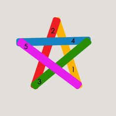 three colored sticks with numbers on them in the shape of an x and one star