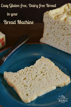 a piece of bread on a blue plate with a fork next to it and a box of gluten - free dairy - free bread in the background