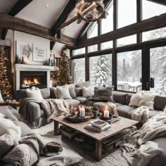 a living room filled with lots of furniture next to a window covered in christmas lights