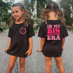 -In My Big Sister Era Shirt, Cute Big Sister Shirt, Funny Toddler T-shirt, Cute Retro Big Sis Kids Shirt, Big Sis Tee, Two Side Sister Shirt Welcome to LittleLambsLounge! -Our products come in 3 types: onesie® bodysuit, toddler, and youth size shirt. -The monthly sizes you choose will come as bodysuit® onesie®, available in both long sleeve and short sleeve options. We take pride in offering a delightful range of clothing for your little ones, crafted from super-soft fabrics that both you and your baby will adore. Our commitment is evident in every thread, as each piece is sustainably handmade-to-order, accompanied by a certificate of authenticity. FEATURES: We prioritize your kids' comfort! Our garments are made from ethically sourced ultra-soft fabrics and printed with safe, eco-friendly Cute Black Tops For School, Cute Black Short Sleeve Shirt, Cute Short Sleeve Shirt With Funny Text, Cute Short Sleeve Shirt With Slogan, Cute Short Sleeve Shirt With Text Print, Cute Short Sleeve Shirt With Name Print, Cute Short Sleeve Tops With Name Print, Big Sister Shirt Ideas, Big Cousin Shirt