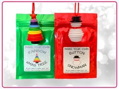 two bags with different colored plastic items in them on a white background, one has a red bag that says make your own button and the other is green bag