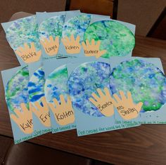 six handprinted cards with blue and green colors on them, each depicting the same child's name