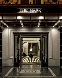 the mark hotel entrance is lit up at night